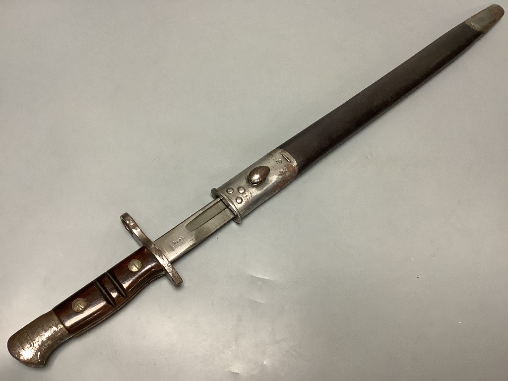 A WWII bayonet, blade marked ‘1913 3 17 REMINGTON’